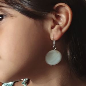 Item sold is a quarter size hanging stone earrings